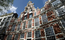 Schilderwerk aan monumentaal grachtenpand amsterdam